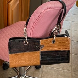 Rectangular pocketbook in brown & black. strap is part chain part leathe…